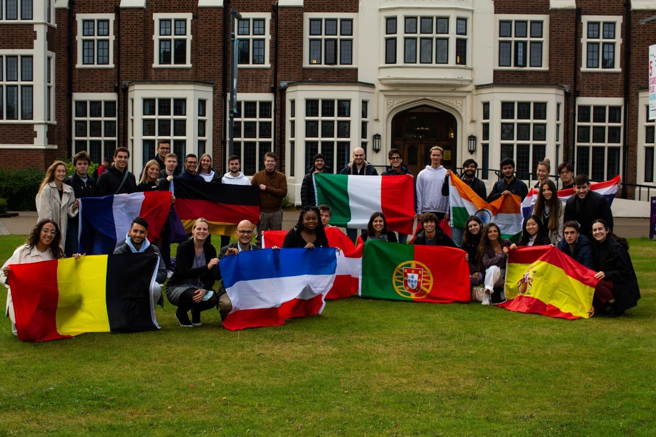 XLRI exchange students abroad holding their national flags